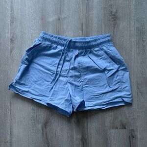 Alo Yoga track shorts.